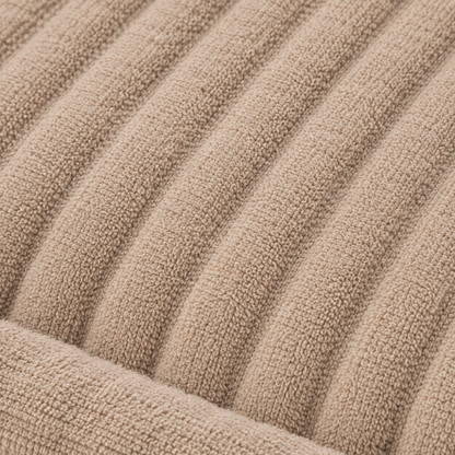 Rectangular dog bed in beige with a ribbed raised rim