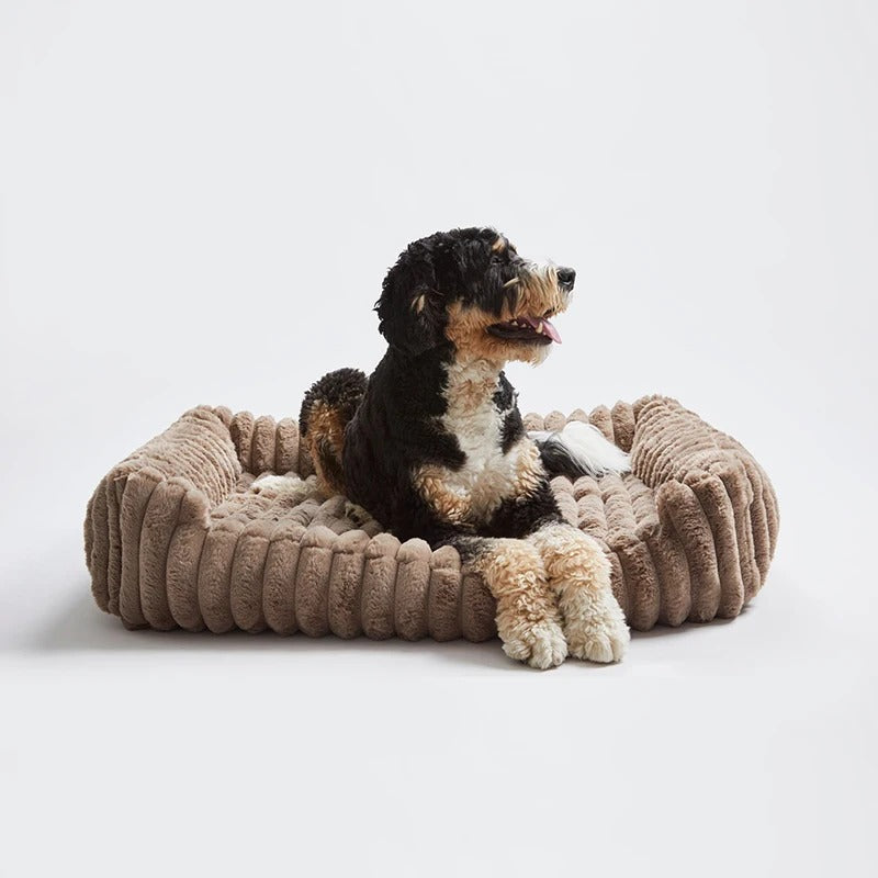 Rectangular dog bed in taupe with a wide ribbed rim