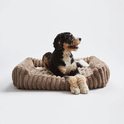 Rectangular dog bed in taupe with a wide ribbed rim