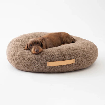 Round donut dog bed in taupe