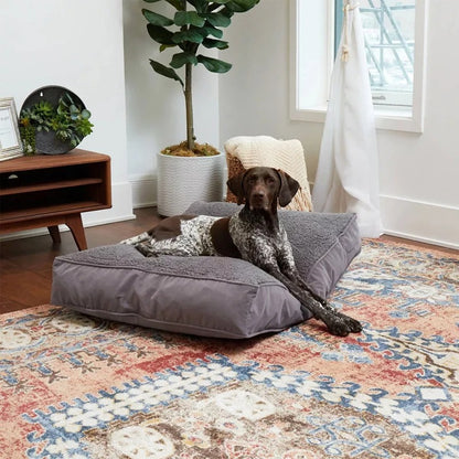 Rectangular dog cushion in grey with a textured top surface